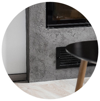 Fireplace wall decorated with Microbond with a three-dimensional stamped effect